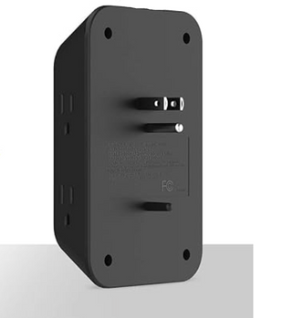 A black universal travel adapter plug shown from the back, featuring a two-prong US outlet and a small built-in USB-C port, set against a white background with some product listing text partially visible on the right.